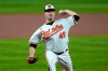 Baltimore Orioles starting pitcher Keegan Akin throws a pitch to the Atlanta Braves during the first inning of a baseball game, Wednesday, Sept. 16, 2020, in Baltimore. (AP Photo/Julio Cortez)
