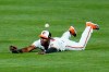 Baltimore Orioles center fielder Cedric Mullins is unable to make a diving catch on a ball hit by Boston Red Sox's Christian Vazquez during the second inning of a baseball game, Thursday, Aug. 20, 2020, in Baltimore. (AP Photo/Julio Cortez)