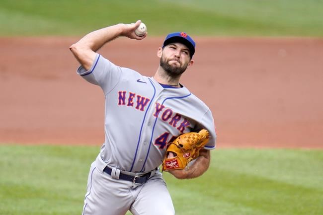 New York Mets starting pitcher Michael Wacha throws a pitch to the Baltimore Orioles during the second inning of a baseball game, Wednesday, Sept. 2, 2020, in Baltimore. (AP Photo/Julio Cortez)