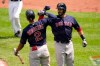 Boston Red Sox's J.D. Martinez, right, is greeted near home plate by Xander Bogaerts after hitting a solo home run off Baltimore Orioles starting pitcher Jorge Lopez during the third inning of a baseball game, Sunday, April 11, 2021, in Baltimore. (AP Photo/Julio Cortez)