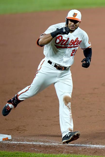 Baltimore Orioles' Anthony Santander reacts while running the bases after hitting a two-run home run off New York Mets relief pitcher Franklyn Kilome during the sixth inning of a baseball game, Tuesday, Sept. 1, 2020, in Baltimore. Orioles' Pat Valaika scored on the home run. (AP Photo/Julio Cortez)