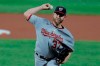 Washington Nationals starting pitcher Stephen Strasburg throws a pitch to the Baltimore Orioles during the first inning of a baseball game, Friday, Aug. 14, 2020, in Baltimore. (AP Photo/Julio Cortez)