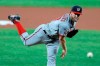 Washington Nationals starting pitcher Stephen Strasburg throws a pitch to the Baltimore Orioles during the first inning of a baseball game, Friday, Aug. 14, 2020, in Baltimore. (AP Photo/Julio Cortez)