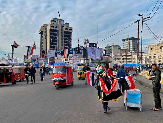 In this Monday, Jan. 13, 2020 photo, protesters stage a sit-in at Tahrir Square during ongoing protests in Baghdad, Iraq. Mass protests by young Iraqis against their country's ruling elite helped force the resignation of the prime minister, but with the focus now turning to the conflict between the United States and Iran, demonstrators fear the momentum is being drawn away from their goals. The four-month old protest movement was already struggling amid internal divisions and a fierce security crackdown. (AP Photo/Khalid Mohammed)