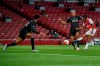 Arsenal's Reiss Nelson, right, scores his team second goal during the English Premier League soccer match between Arsenal and Liverpool at the Emirates Stadium in London, England, Wednesday, July 15, 2020. (Glyn Kirk/Pool via AP)