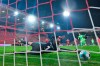 Wolfsburg's Wout Weghorst, background right, scores on a penalty shot past Union Berlin's goalkeeper Andreas Luthe during a German Bundesliga soccer match between Union Berlin and Wolfsburg, at the Stadion An der Alten FÃ¶rsterei, in Berlin, Saturday, Jan. 9, 2021. (John Macdougall/Pool Photo via AP)
