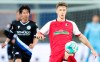 Freiburg's Yannik Keitel, right, controls the ball next to Bielefeld's Masaya Okugawa during the Bundesliga soccer match between Arminia Bielefeld and SC Freiburg at Schuco Arena, Bielefeld, Germany, Friday April 9, 2021. (Friso Gentsch/dpa via AP)