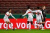 Stuttgart's Silas Wamangituka, center, celebrates scoring a goal with his teammates, during the German Soccer Cup round of 16 match between VfB Stuttgart and Moenchengladbach at Mercedes-Benz Arena in Stuttgart, Germany, Wednesday, Feb. 3, 2021. (Marijan Murat/dpa via AP)