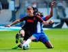 Augsburg's Florian Niederlechner in action with Hertha BSC's Dedryck Boyata during the German Bundesliga soccer match between Hertha Berlin and Augsburg at the Olympiastadion in Berlin, Germany, Saturday, May 30, 2020. Because of the coronavirus outbreak all soccer matches of the German Bundesliga take place without spectators. (Hannibal Hanschke/pool photo via AP)