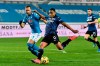 Atalanta's Luis Muriel, right, shoots to score his side's third goal during a Serie A soccer match between Atlanta and Napoli, in Bergamo's Atleti Azzurri d'Italia stadium, Italy, Sunday, Feb. 21, 2021. (Gianluca Checchi/LaPresse via AP)