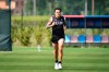 Bologna's Federico Santander warms up during a training session in Bologna, Italy, Tuesday, May 5, 2020. No soccer balls. No contact with teammates. And no entering the locker room. One by one, Serie A players are returning to the training field this week under a strict set of guidelines amid the coronavirus pandemic (Massimo Paolone/LaPresse via AP)