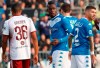 FILE - In this Saturday, Nov. 9, 2019 filer, Brescia's Mario Balotelli, center, walks on the pitch during the Serie A soccer match between Brescia and Torino at the Mario Rigamonti Stadium in Brescia, Italy. Three leaders of the extreme-right Forza Nuova political party have been stopped by police for putting up a racist banner aimed at Brescia striker Mario Balotelli. The banner, which read “Mario you’re right, you’re an African,” was posted on a fence outside Juventus’ Allianz Stadium in Turin last month. The words “Mario” and “African” were written in red with the other words in black. The banner also featured a logo for the neo-fascist Forza Nuova party. (Filippo Venezia/ANSA via AP, File)