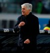 Atalanta head coach Gian Piero Gasparini follows the Italian Serie A soccer match between Brescia and Atalanta, at the Mario Rigamonti stadium in Brescia, Italy, Saturday, Nov. 30, 2019. (Filippo Venezia/ANSA via AP)