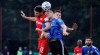 Leverkusen's Lucas Alario, left, and Saarbruecken's Manuel Zeitz, right, go for a hader during the German soccer cup, DFB Pokal, semi-final match between 1. FC Saarbruecken and Bayer 04 Leverkusen in Voelklingen, Germany, Tuesday, June 9, 2020. (Ronald Wittek/Pool Photo via AP)