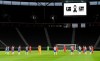 Players observe a minute's silence to commemorate the victims of the coronavirus pandemic prior to the German Bundesliga soccer match between Hertha BSC Berlin and 1. FC Union Berlin in Berlin, Germany, Friday, May 22, 2020. The German Bundesliga is the world's first major soccer league to resume after a two-month suspension because of the coronavirus pandemic. (Stuart Franklin/Pool Photo via AP)
