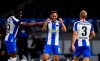 Hertha's Matheus Santos Carneiro Da Cunha, center, celebrates scoring his side's third goal during the German Bundesliga soccer match between Hertha BSC Berlin and 1. FC Union Berlin in Berlin, Germany, Friday, May 22, 2020. The German Bundesliga is the world's first major soccer league to resume after a two-month suspension because of the coronavirus pandemic. (Stuart Franklin/Pool Photo via AP)
