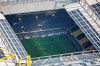 In this aerial image soccer players of both teams play the game in front of empty spectator stands during the German Bundesliga soccer match between Borussia Dortmund and FC Bayern Munich in Dortmund, Germany, Tuesday, May 26, 2020. The German Bundesliga is the world's first major soccer league to resume after a two-month suspension because of the coronavirus pandemic. (Federico Gambarini/DPA via AP, Pool)