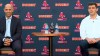 In this still image from an online video news conference provided by the Boston Red Sox, manager Alex Cora, left, and Chief Baseball Officer Chaim Bloom, right, listen to a question Tuesday, Nov. 10, 2020, at Fenway Park in Boston. Cora, who led the Red Sox to the 2018 World Series title, was rehired as manager less than a year after the team let him go because of his role in the Houston Astros' cheating scandal. (Boston Red Sox via AP)