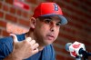 FILE— In this Sept. 9, 2019, file photo, Boston Red Sox manager Alex Cora talks about the dismissal of president of baseball operations Dave Dombrowski, during a news conference before the team's baseball game against the New York Yankees in Boston. Cora was fired by the Red Sox on Tuesday, Jan. 14, 2020, a day after baseball Commissioner Rob Manfred implicated him in the sport's sign-stealing scandal. (AP Photo/Michael Dwyer, File)