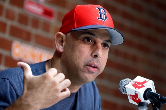 FILE— In this Sept. 9, 2019, file photo, Boston Red Sox manager Alex Cora talks about the dismissal of president of baseball operations Dave Dombrowski, during a news conference before the team's baseball game against the New York Yankees in Boston. Cora was fired by the Red Sox on Tuesday, Jan. 14, 2020, a day after baseball Commissioner Rob Manfred implicated him in the sport's sign-stealing scandal. (AP Photo/Michael Dwyer, File)