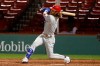 Philadelphia Phillies' Bryce Harper follows through on his three run home run against the Boston Red Sox during the sixth inning of a baseball game Tuesday, Aug. 18, 2020, at Fenway Park in Boston. (AP Photo/Winslow Townson)