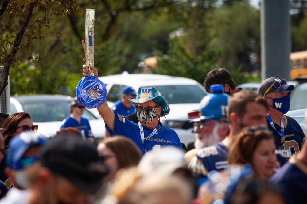 Daniel Crump / Winnipeg Free Press. A Bombers fan holds up a Banjo as he waits to enter IG Field prior to game time Saturday afternoon. September 11, 2021.