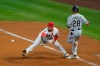 Chicago White Sox's Leury Garcia (28) makes it safely to first ahead of a throw to Los Angeles Angels first baseman Jared Walsh (20) during the fifth inning of a baseball game Sunday, April 4, 2021, in Anaheim, Calif. (AP Photo/Ashley Landis)