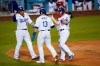 Los Angeles Dodgers' Justin Turner (10), Max Muncy (13), and Will Smith (16) celebrate after they all scored off of a home run hit by Smith during the fourth inning of a baseball game against the Cincinnati Reds Tuesday, April 27, 2021, in Los Angeles. (AP Photo/Ashley Landis)
