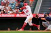 Los Angeles Angels' David Fletcher (22) doubles during the second inning of a baseball game against the Seattle Mariners Saturday, July 17, 2021, in Anaheim, Calif. Taylor Ward, Juan Lagares, and Jack Mayfield scored. (AP Photo/Ashley Landis)