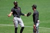 San Francisco Giants' Hunter Pence, left, gestures while speaking with manager Gabe Kapler during a baseball practice Friday, July 10, 2020, in San Francisco. (AP Photo/Ben Margot)