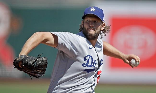 Los Angeles Dodgers' pitcher Clayton Kershaw works against the San Francisco Giants in the first inning of the first game of a baseball doubleheader Thursday, Aug. 27, 2020, in San Francisco. (AP Photo/Ben Margot)