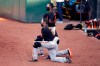 San Francisco Giants' manager Gabe Kapler kneels during the national anthem prior to an exhibition baseball game against the Oakland Athletics, Monday, July 20, 2020, in Oakland, Calif. (AP Photo/Ben Margot)