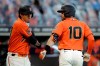 San Francisco Giants Evan Longoria (10) celebrates with Wilmer Flores after hitting a home run off Oakland Athletics' Jesus Luzardo in the first inning of a baseball game Friday, Aug. 14, 2020, in San Francisco. (AP Photo/Ben Margot)
