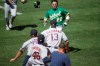 Oakland Athletics' Ramon Laureano (22) charges the Houston Astros' dugout after being hit by a pitch thrown by Humberto Castellanos during the seventh inning of a baseball game Sunday, Aug. 9, 2020, in Oakland, Calif. (AP Photo/Ben Margot)