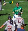 Oakland Athletics' Ramon Laureano (22) charges the Houston Astros' dugout after being hit by a pitch thrown by Humberto Castellanos during the seventh inning of a baseball game Sunday, Aug. 9, 2020, in Oakland, Calif. (AP Photo/Ben Margot)