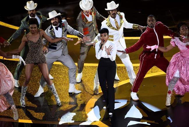 Janelle Monae, center, performs onstage at the Oscars on Sunday, Feb. 9, 2020, at the Dolby Theatre in Los Angeles. (AP Photo/Chris Pizzello)