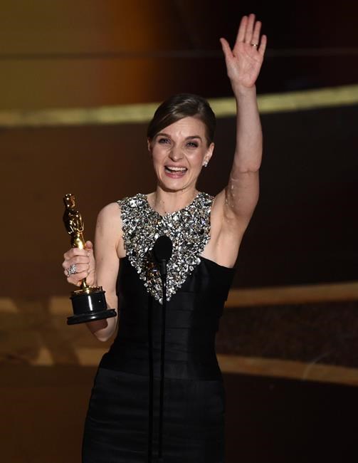 Hildur Guonadottir accepts the award for best original score for