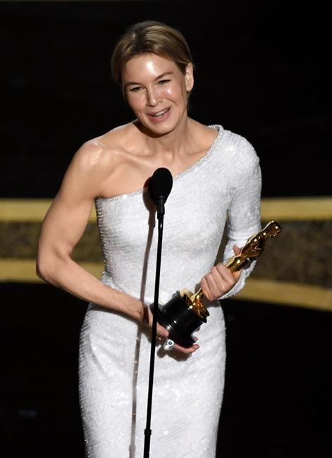 Renee Zellweger accepts the award for best performance by an actress in a leading role for