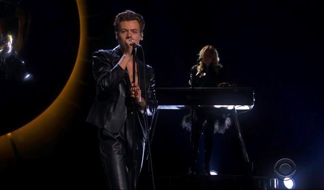 In this video grab provided by CBS and the Recording Academy, Harry Styles performs at the 63rd annual Grammy Awards at the Los Angeles Convention Center on Sunday, March 14, 2021. (CBS/Recording Academy via AP)