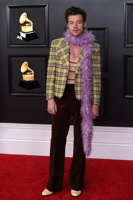 Harry Styles poses in the press room at the 63rd annual Grammy Awards at the Los Angeles Convention Center on Sunday, March 14, 2021. (Photo by Jordan Strauss/Invision/AP)