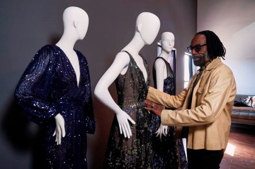 Fashion designer Kevan Hall pauses for a picture with his 