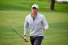 Rory McIlroy of Northern Ireland waves to the gallery after hitting out of a fairway bunker on the fourth hole of the South Course at Torrey Pines Golf Course during the second round of the Farmers Insurance golf tournament Friday Jan. 24, 2020, in San Diego. (AP Photo/Denis Poroy)