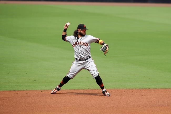 San Francisco Giants shortstop Brandon Crawford throws out San Diego Padres Fernando Tatis Jr., on a ground ball in the first inning of a baseball game Sunday, Sept. 13, 2020, in San Diego. (AP Photo/Derrick Tuskan)