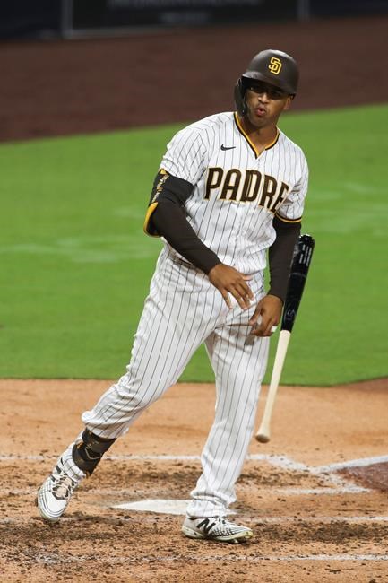 San Diego Padres' Trent Grisham tosses his bat after hitting a solo home run off Los Angeles Dodgers starting pitcher Clayton Kershaw in the sixth inning of a baseball game Monday, Sept. 14, 2020, in San Diego. (AP Photo/Derrick Tuskan)