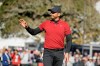 Jason Day, of Australia, waves after making a birdie putt on the 18th green of the Pebble Beach Golf Links during the second round of the AT&T Pebble Beach National Pro-Am golf tournament Friday, Feb. 7, 2020, in Pebble Beach, Calif. (AP Photo/Eric Risberg)