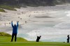 Luke Donald, center, hits from the ninth fairway of the Pebble Beach Golf Links during the second round of the AT&T Pebble Beach Pro-Am golf tournament Friday, Feb. 12, 2021, in Pebble Beach, Calif. (AP Photo/Eric Risberg)