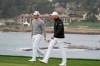 Patrick Cantlay, left, and Daniel Berger walk up to the sixth green of the Pebble Beach Golf Links during the final round of the AT&T Pebble Beach Pro-Am golf tournament Sunday, Feb. 14, 2021, in Pebble Beach, Calif. (AP Photo/Eric Risberg)