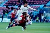 Cagliari's Leonardo Pavoletti and Roma's Chris Smalling, top, vie for the ball during the Serie A soccer match between Cagliari and Roma, at the Sardegna Arena in Cagliari, Italy, Sunday, April 25, 2021. (Alessandro Tocco/LaPresse via AP)