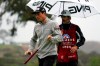 Viktor Hovland, left, of Norway, waits to putt on the eighth hole of the South Course during the second round of the Farmers Insurance Open golf tournament at Torrey Pines, Friday, Jan. 29, 2021, in San Diego. (AP Photo/Gregory Bull)