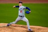 Los Angeles Dodgers starting pitcher Walker Buehler works against a San Diego Padres batter during the second inning of a baseball game Friday, April 16, 2021, in San Diego. (AP Photo/Gregory Bull)